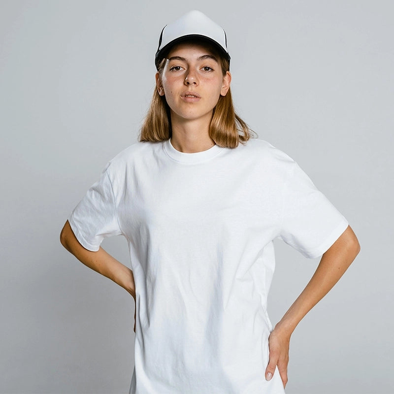 Female model wearing a plain white t-shirt in a confident pose – ideal for Kadam Colors dye transformations.
