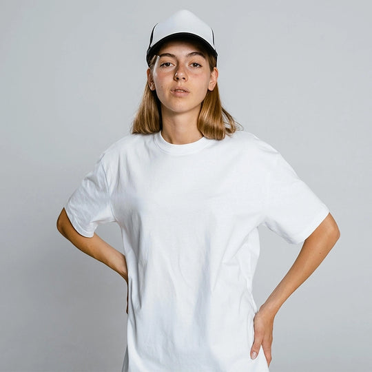 Female model wearing a plain white t-shirt in a confident pose – ideal for Kadam Colors dye transformations.