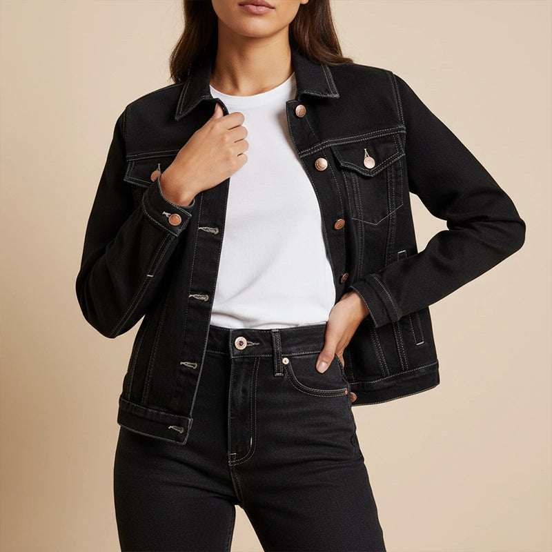 Woman wearing a black denim jacket and jeans dyed with Kadam Pakka Rang Jeans Black.